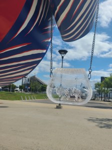 Photograph is of a clear acrylic purse that has "Bills Mafia" engraved inside of a buffalo. Setting for photoshoot is Highmark Stadium, home of the Buffalo Bills.