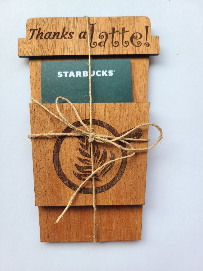 Photograph of wooden gift card holder that has "Thanks a Latte" engraved on the top.