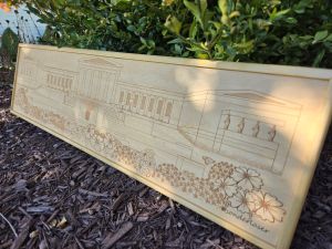Custom wooden sign showcasing an intricate laser-engraved scene of Buffalo, New York's Art Gallery. Each sign is custom framed in polished wood, reflecting the craftsmanship and artistry behind their creation.