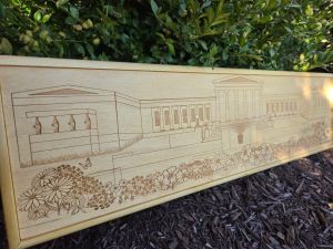 Custom wooden sign showcasing an intricate laser-engraved scene of Buffalo, New York's Art Gallery. Each sign is custom framed in polished wood, reflecting the craftsmanship and artistry behind their creation.